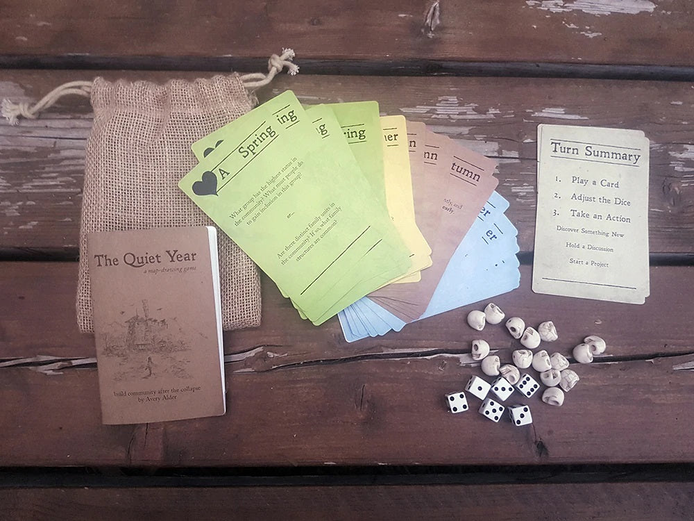 Image of the cards and dice that come with game The Quiet Year